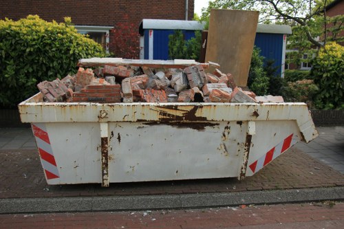 A busy construction site in Wandsworth with waste clearance operations